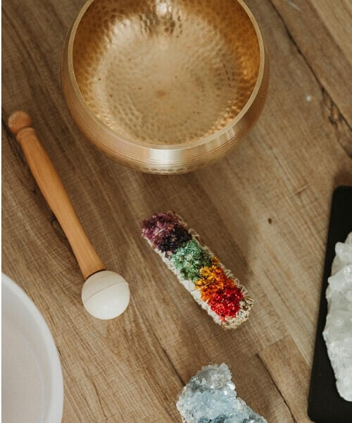 sound healing instruments on a wooden floor